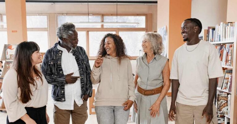A group of diverse people discussing a nonprofit venture