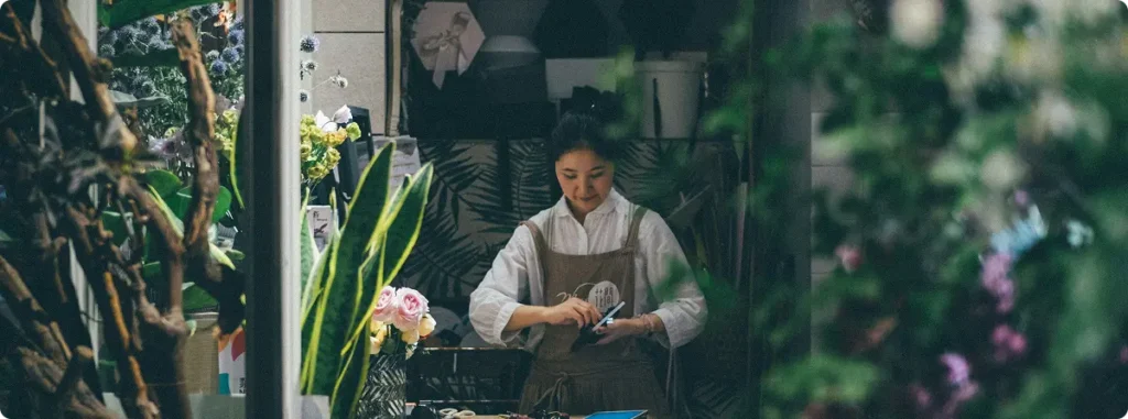 A woman business owner in her flower shop.